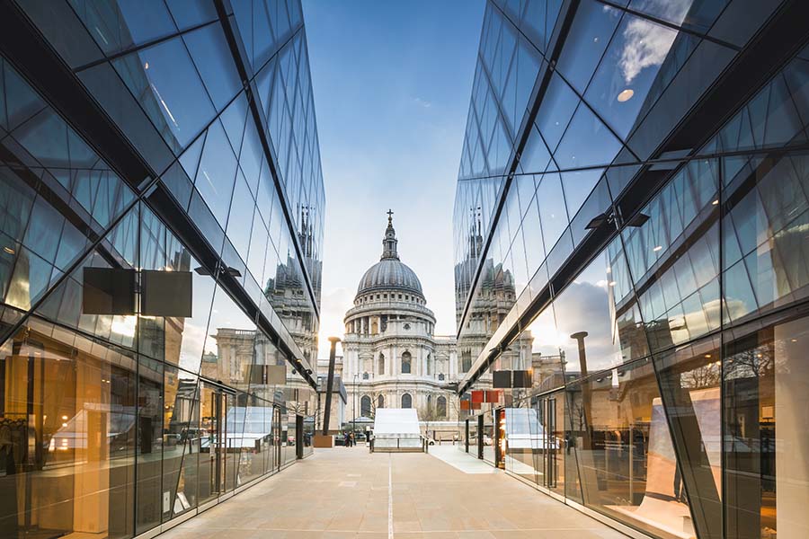 Insurance Quote - View of St Pauls Cathedral in London Reflected Off Glass Panels on Modern Building